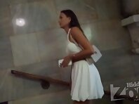 Up4167#Upskirt of a tanned girl in a short white dress. Our cameraman managed to slip his ha