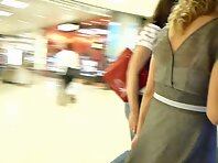 Up1655#A woman in a gray dress. The operator used a backlight. Ass in black thong and pimple