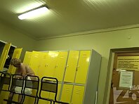 Lo1294#Older woman undressing in the pool locker room. Demonstrates us her body with big tit