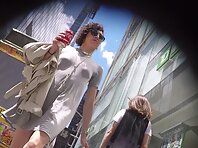 Up4230#Under the skirt of a girl in a short gray dress. Our cameraman managed to catch a clo