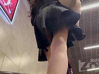 Up4339#Under the skirt of a girl in a loose black dress. Our cameraman managed to catch a cl