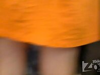 Up1665#A girl in a short orange skirt. Pimply ass and shaved crotch in cherry panties.