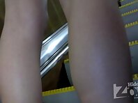 Up1894#A slender girl in a short blue skirt. In the subway you can take a great hot teen gir