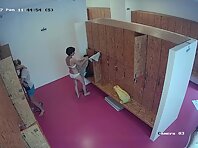 Lo1948#New women go to the locker room. They go to their lockers and begin to take off their