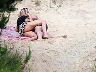 Nu1935#A man and a woman came to the beach. They think that there is no one around and they 