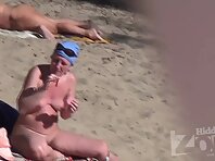 Nu1863#Woman on a nudist beach shows us the body. She has a good chest and neat shaved pussy