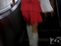 Up2084#Young blond woman in a short denim skirt. Our cameraman was able to film close-up of 