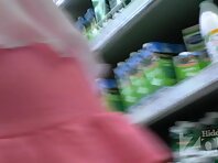 Up2672#Tanned beauty in a short pink skirt. Our cameraman photographed her shaved crotch in 