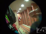 Sh941#The woman in glasses undressed, took a shower and puts on a swimsuit in the shower