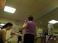 Lo2116#One of the girls finished sports and is in no hurry to dress. She walks topless and h