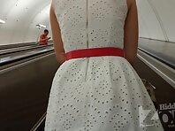 Up4384#Under the skirt of a girl in a loose white dress. Her pubic area and shaved crotch, c