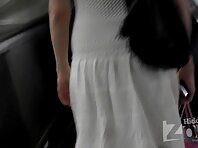 Up1999#Slender blonde in a short white dress. Nice ass in white panties. On escalator can sh