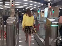 Up4213#A girl in a short, multicolored skirt is upskirted. Our cameraman managed to slip his