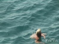 Nu1216#The blonde continues to swim in the sea, but soon comes up on the shore, and again, w