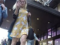 Up4196#Under the skirt of a girl in a short black and white dress. Our cameraman caught a cl