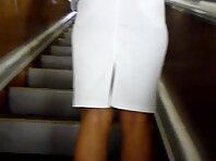 Up1582#Tanned babe in a white skirt. Beautiful crotch in white panties