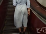 Up3025#Upskirt woman in long blue dress. Our cameraman had been preparing for a long time an