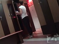 Lo1372#Elegant chick for a while just standing around the locker, but then starts to take of