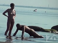 Nu1488#Nude beach voyeur cam focused on the girl with big boobs. Here is something to see! S