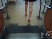 Up3033#Under the skirt of a slender brunette in a short black dress. Our operator several ti