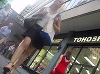 Up4154#Upskirt of a tanned girl in a short black skirt. Our cameraman managed to catch a clo