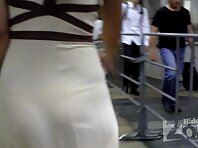 Up1815#Brunette in a wide white dress. Through her ??dress translucent lace panties. Beautif