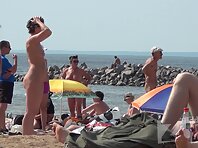 Nu1330#Shooting of a hidden camera at a nude beach. In the frame gets a beautiful naked girl