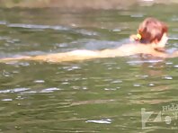 Nu1965#The man and the woman went swimming. They have a very happy look. They clearly antici