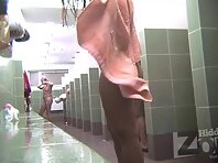 Sh2052#The girl is drying herself with a towel right in front of the camera. Then she smears