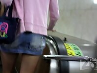 Up1792#A girl in a short denim skirt. Great shot of the crotch. Nice ass in white panties an