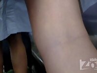 Up1799#A girl in a short white skirt. She wrote a SMS to her phone. I stuck the camera betwe