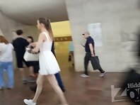 Up4171#Upskirt of a girl in a short white sundress. Our cameraman repeatedly slipped his han