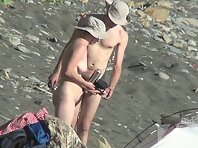 Nu1506#Nude beach voyeur cam continues to watch the young couple. They walk around their ten