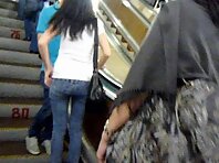 Up1478#Woman in sunglasses, let's see what under she's yellow skirt