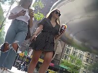 Up4284#Under the skirt of a girl in a short black and white dress. Our cameraman caught a cl
