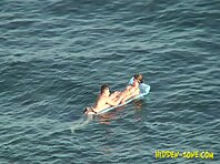 Nu1225#A boy and girl continue to swimming on a mattress. Great hidden camera nude beach clo