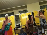 Lo1300#Three young girls dress up and wiped off after a shower in the pool locker room. Our 