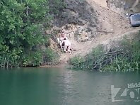 Nu1948#In summer, you can see a lot of interesting things on the lake. A man sits in an armc