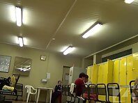 Lo1308#Girls dress up in the locker room. Young tanned babe walks by our operator completely