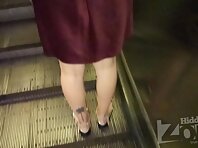 Up2851#Under the skirt of a brunette in a short brown dress. Our operator several times put 