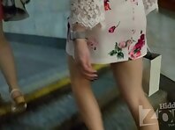 Up2908#Under the skirt of a slender brunette in a short white dress. Our operator several ti