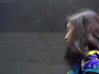 Up2937#Under the skirt of a brunette in a short multi-colored dress. Our cameraman photograp