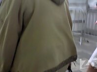 Up1926#Red-haired beauty in a short white dress. On the escalator in the metro can shoot gre