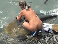 Nu1585#Girl bathing in the surf. She pointed tits with large nipples. Some enjoy this form o