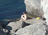 Nu2258#Another pair sunbathes on the rocks. The girl has beautiful breasts and shaggy cunt. 