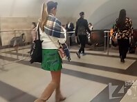 Up3011#Upskirt to tanned beauty in short green skirt. A beautiful tanned ass and a shaved cr