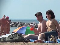 Nu1328#Next to the operator of our nude beach voyeur cam young couple sunbathing. They treat