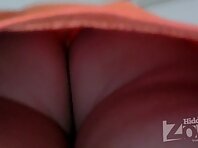 Up1998#Slender brunette in a short red skirt. Our cameraman filmed with a hidden camera her 