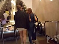 Up4131#Upskirt of a girl in a short white skirt. Our cameraman brazenly slipped his hand und