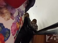 Up2928#Upskirt girl in a short multi-colored skirt. Our operator several times put his hand 